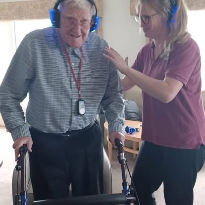 Care home residents taking part in a funded silent disco group session
